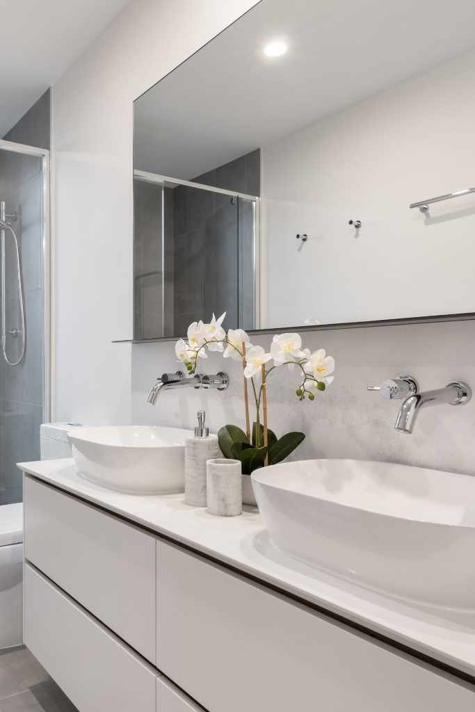 white bathroom with two sinks